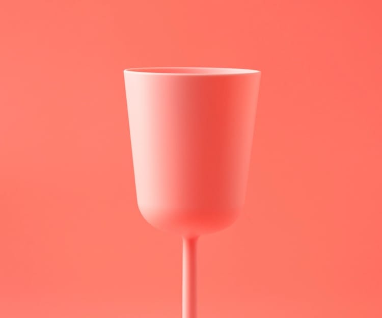 image of a glass with pink background